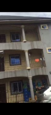 Sharp 2 story building of 9 flats 1 bedroom flat each well fence with gate for sale